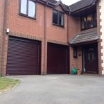 A Pair of Timber Effect Automated Roller Doors
