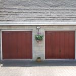 A Pair of GRP Up & Over Doors on White Steel Frames